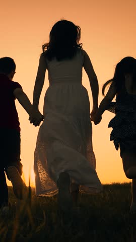 silhouette mother runs into sunset holding her child son daughter hand, happy family running, boy girl, together we will reach stars, childhood dreams, creating wonderful show teamwork unity, building