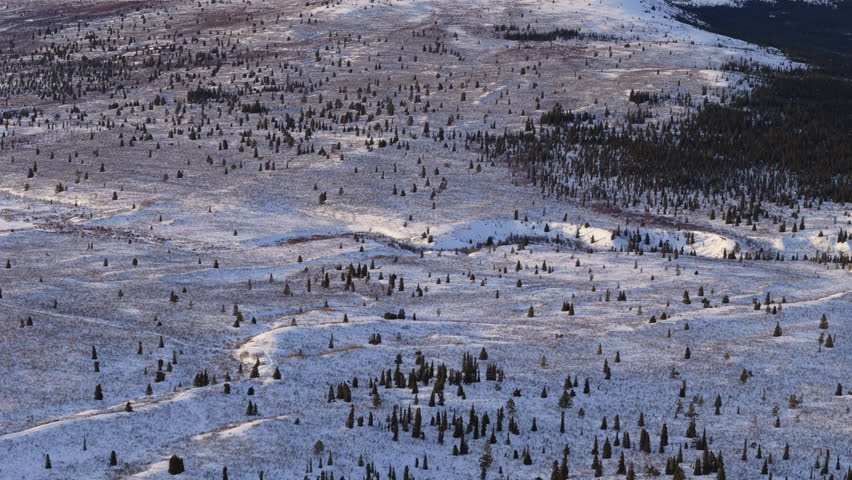Explore the frozen tranquility of Fish Lake and its surrounding mountains near Whitehorse, Yukon. Aerial footage captures Canada’s pristine winter scenery at its finest
