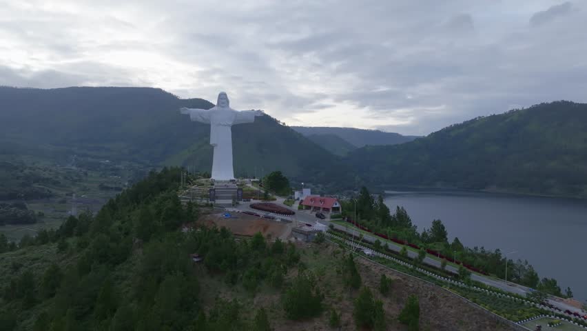 Aerial view of Jesus Christ on Sibeabea Hill in North Sumatra, overlooking Lake Toba