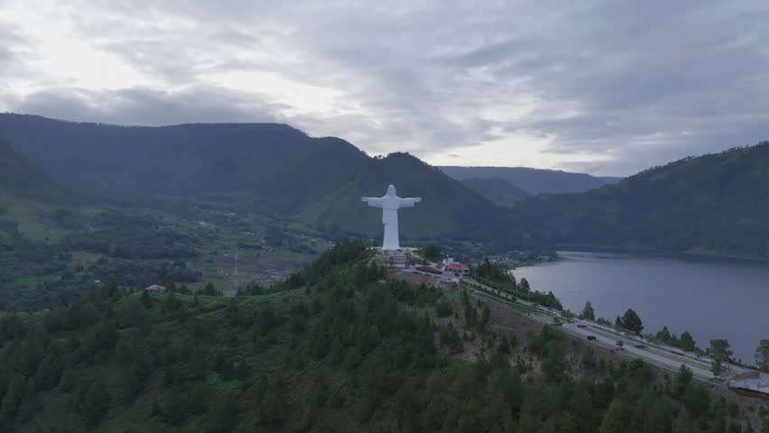 Aerial view of Jesus Christ on Sibeabea Hill in North Sumatra, overlooking Lake Toba