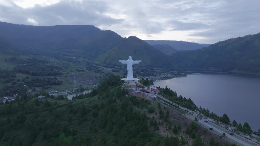 Aerial view of Jesus Christ on Sibeabea Hill in North Sumatra, overlooking Lake Toba