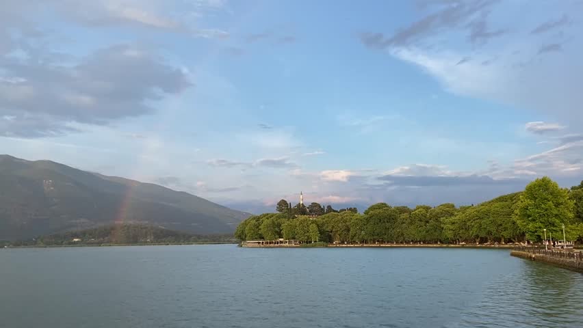 full rainbow visible over Lake Ioannina, Greece