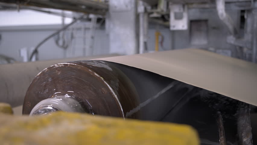 Cylindrical object for leveling surface of cardboard web. Special machine allows removing defects from thin material sheet using rotating part