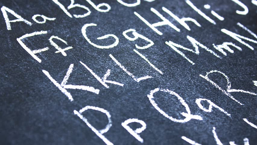 Letters of the English alphabet on the board written in chalk. English alphabet, animation.