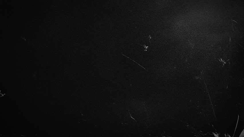 black screen with film stripes and scratches, dynamic animation with film noise, black dynamic stop motion background with soft grunge texture noise and scratches, black empty backdrop