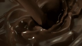 Super Slow Motion Detail Shot of Pouring Melted Chocolate at 1000fps. - Powered by Shutterstock - Get 15% off with code: PIKWIZARD15