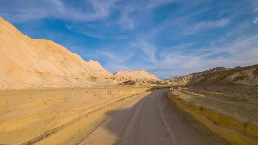 Witness the stunning scenery along the Twenty Mule Team Canyon Road in Death Valley National Park, California, a highlight for visitors and adventurers.
