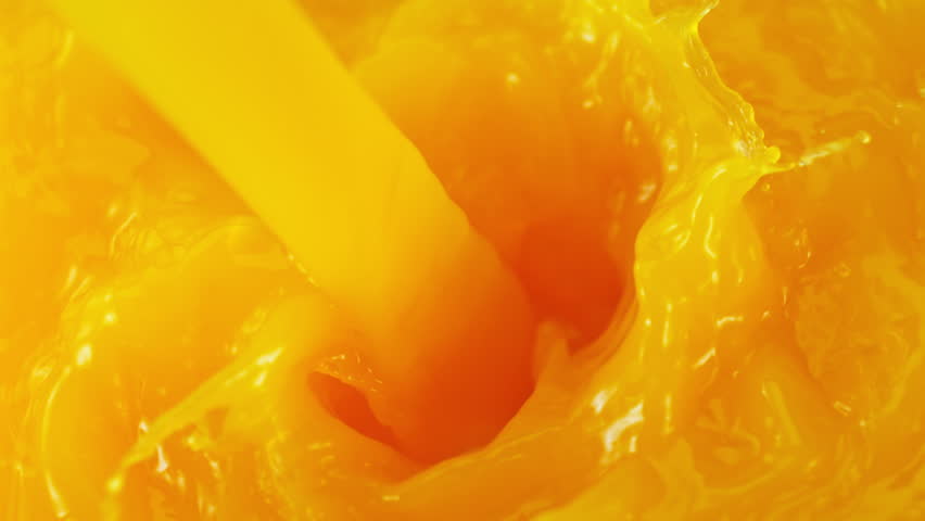 Super Slow Motion Detail Shot of Pouring Fresh Orange Juice at 1000fps.