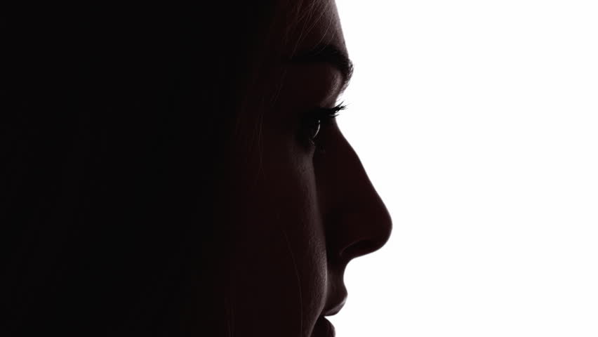 Upset face. Female silhouette. Disappointment loneliness. Dark contrast profile outline of sad depressed woman looking down isolated on white free space.
