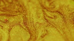 Sparkling flow. Wet ink texture. Shiny liquid spill. Glossy polish. Defocused golden color shimmering paint flow abstract art background. - Powered by Shutterstock - Get 15% off with code: PIKWIZARD15