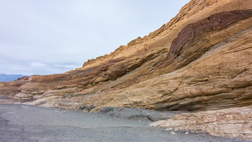 Experience the striking beauty of Mosaic Canyon at Death Valley National Park, California, where colorful rock layers create a stunning landscape.