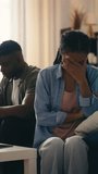 Crying African American woman and her husband sit apart amid relationship crisis - Powered by Shutterstock - Get 15% off with code: PIKWIZARD15