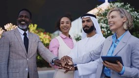 Group of multiethnic business people meeting an emirati businessman - International corporate business team bonding outdoors in the city - Powered by Shutterstock - Get 15% off with code: PIKWIZARD15