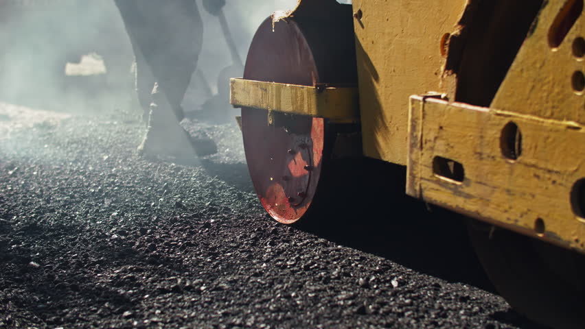 Road construction with asphalt roller