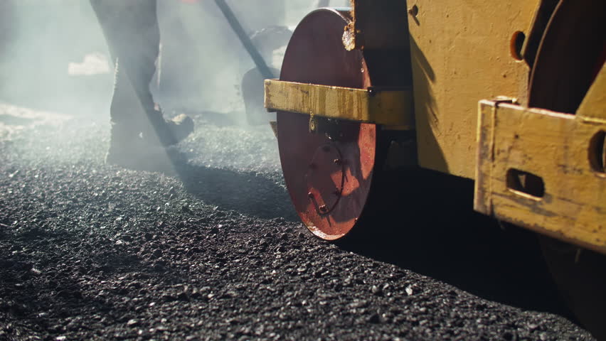 Road construction with asphalt roller