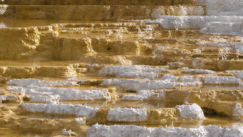Mammoth Hot Springs is a large complex of hot springs on a hill of travertine in Yellowstone National Park adjacent to Fort Yellowstone and the Mammoth Hot Springs Historic District.