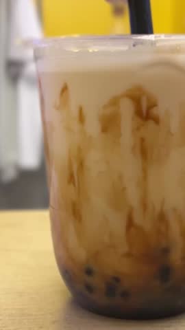 Taiwan milk tea with bubble and cheese burned on wood table