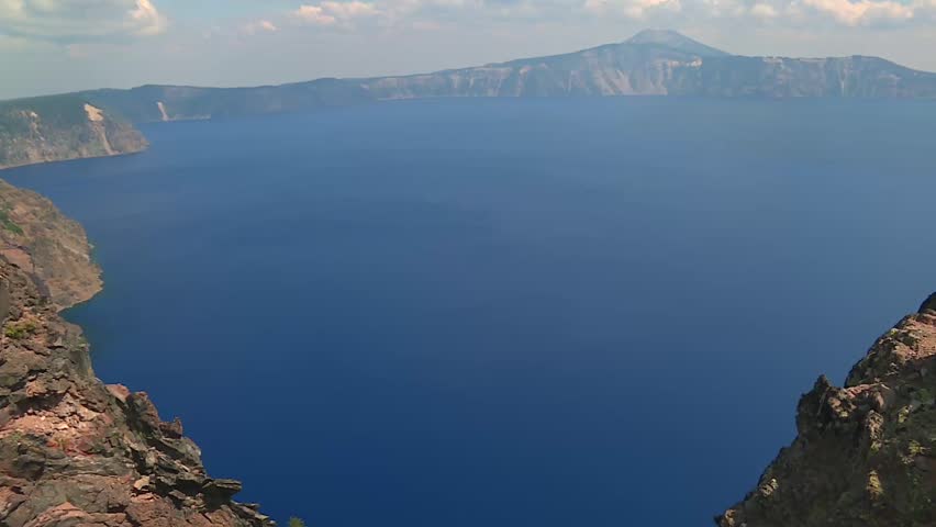 Panoramic view of the iconic Crater Lake in Oregon, USA, with deep blue freshwater from rainfall and snowmelt. Volcanic lake inside caldera