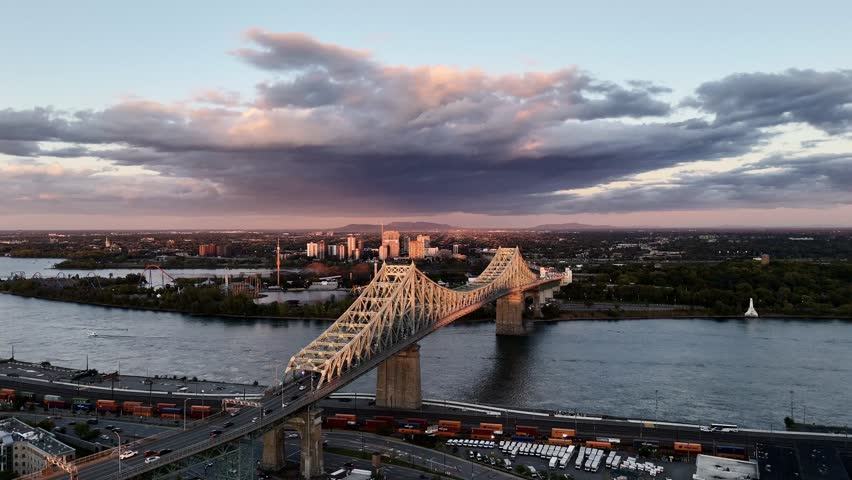 9th of September 2024, cars riding over Jacques-Cartier bridge at sunset, Quebec, Canada