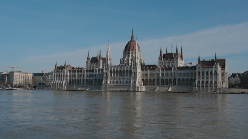 Discover the stunning Parliament Building of Budapest, a Gothic architectural masterpiece along the Danube River, reflecting Hungarys rich cultural heritage for all to appreciate