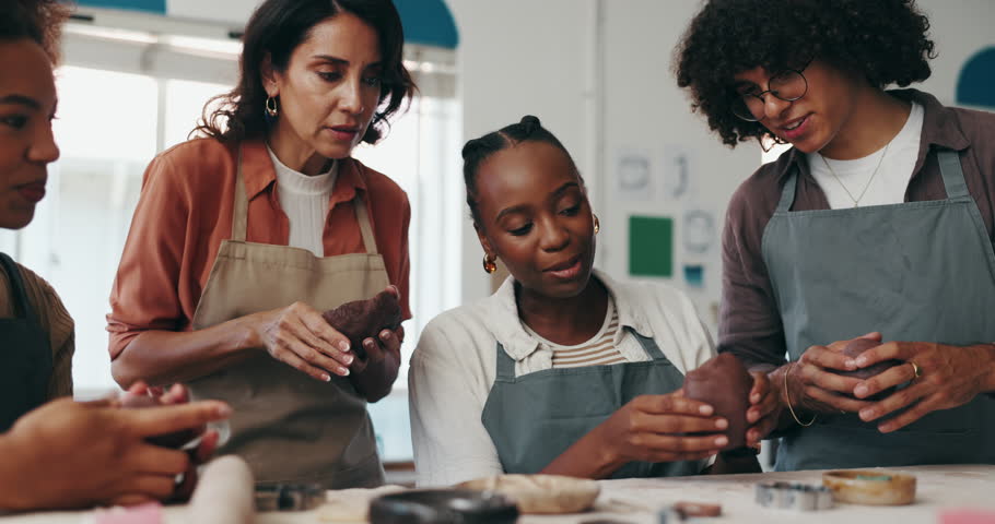 Pottery, happy and teacher with people in workshop for skills with clay, ceramic and sculpture class. Creative, art studio and instructor with group to practice hobby, craft and design to mold object