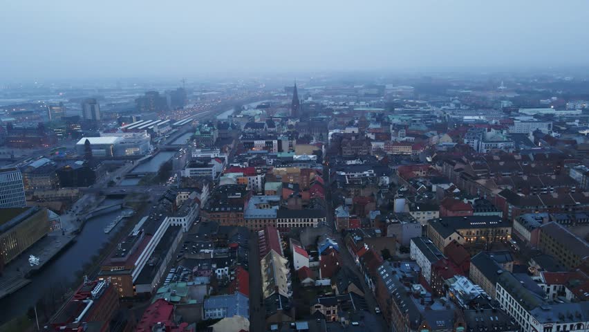 Beautiful aerial of the city of Malmö skyline on a foggy morning in Sweden
