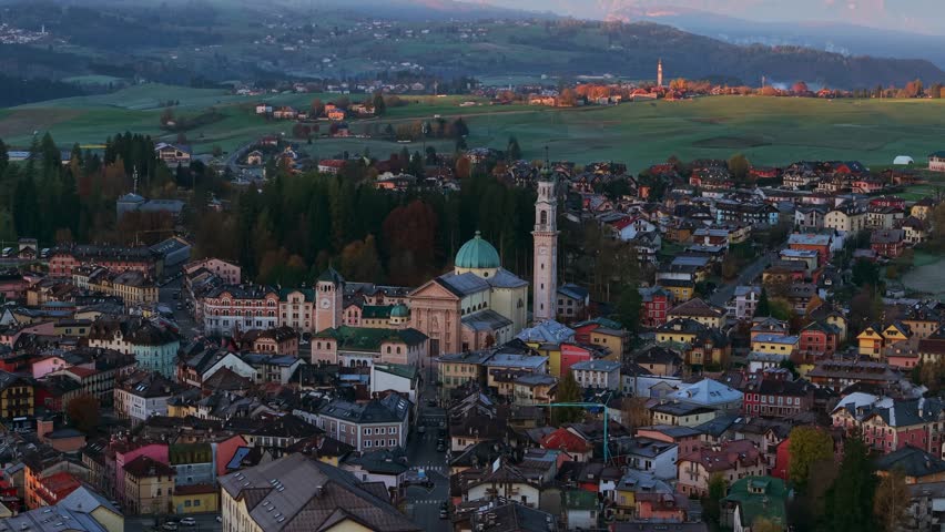 Aerial view of Asiago, a charming township in the Veneto region, surrounded by rolling hills and picturesque landscapes.