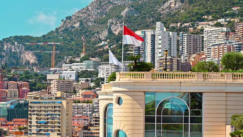 MONACO - AUGUST 21, 2021: Cityscape of the city. Multiple buildings, greenery, hills on the background