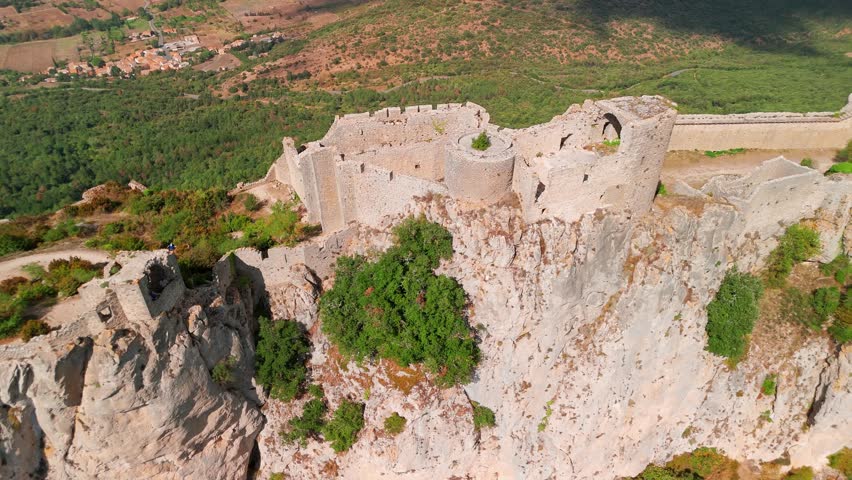 Aerial view of the Cathar medieval castle of Peyrepertuse in the Aude department, southern France. The ruins of magnificent historic castle situated in the French Pyrenees