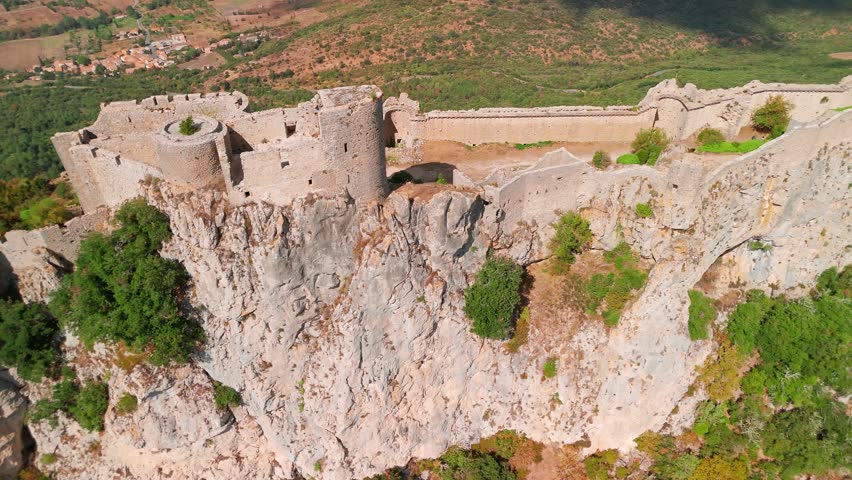 Aerial view of the Cathar medieval castle of Peyrepertuse in the Aude department, southern France. The ruins of magnificent historic castle situated in the French Pyrenees