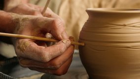 Hand unknown person man decorate ceramic clay vase spinning pottery wheel jug potter making patterns ornament creative craftsman master handmade artist art handcraft workshop hobby pot male sculpting - Powered by Shutterstock - Get 15% off with code: PIKWIZARD15