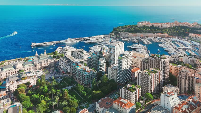 Aerial view of the Monte-Carlo casino in Monaco. Luxurious supercars in front of the hotel. City center of the Principality of Monaco. Famous casino and luxury buildings in Monte Carlo, Monaco