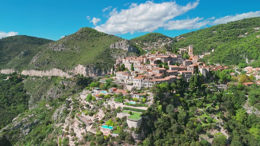 Aerial view of the medieval village of Eze on the Mediterranean coast, French Riviera, France. Historic town of Eze perched on a hilltop, surrounded by breathtaking landscapes and turquoise sea waters