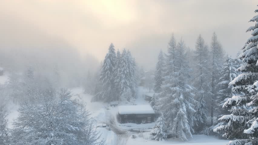 aerial view of foggy winter mountains in ski resort of Chamonix, France, beautiful winter morning in French Alps, winter holidays in Chamonix. High quality 4k footage