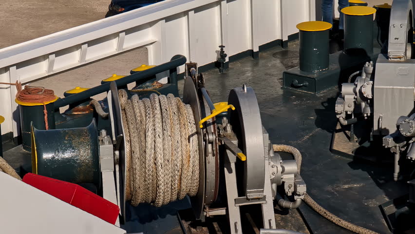 Close-up shot of a ship's rope, navigation equipment, pulleys activating a motor
