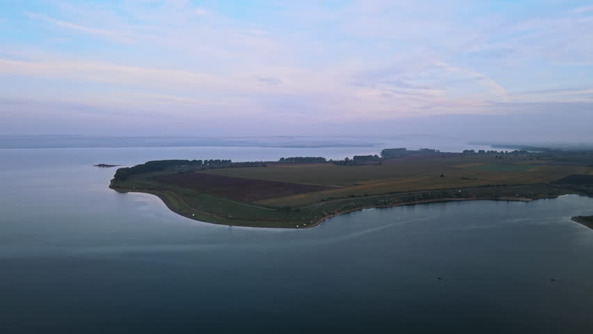 Aerial drone view of the Duruitoarea natural reservation in Moldova. River and fog in the air, fields