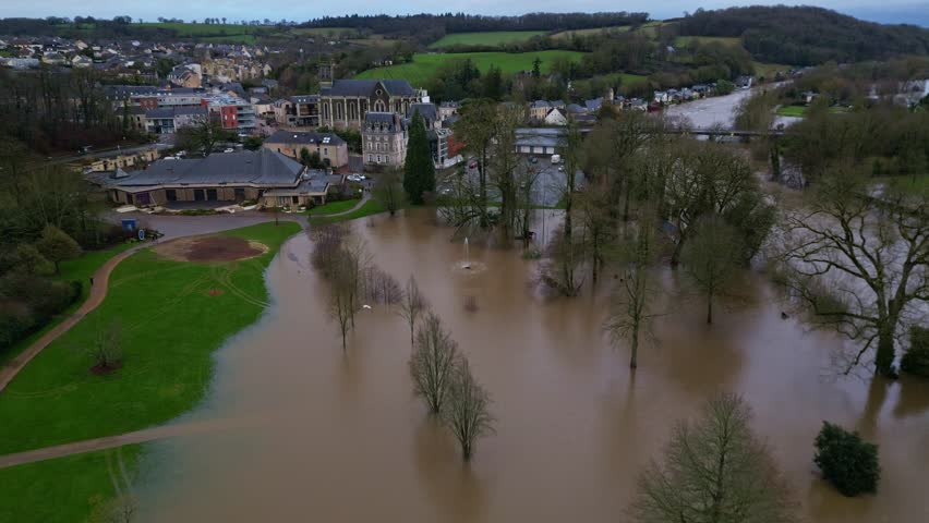 Dramatic drone view of the flooded Le Parc des Ondines public park and buildings, Changé in Mayenne, France.