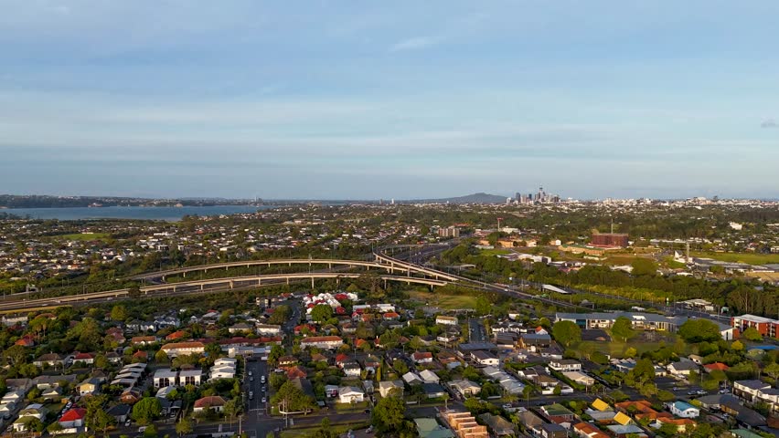 Aerial hyperlapse fly Auckland city, New Zealand Major intersection of State Highway 16 and 20 separating Water view and Point Chevalier districts