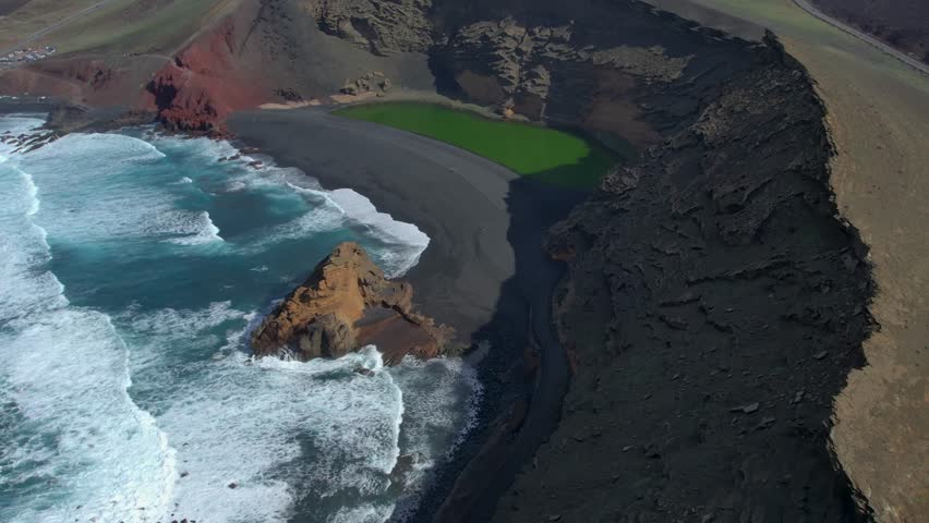 Aerial drone view of mountain sea and volcanoes in Lanzarote, Canary Islands, Spain