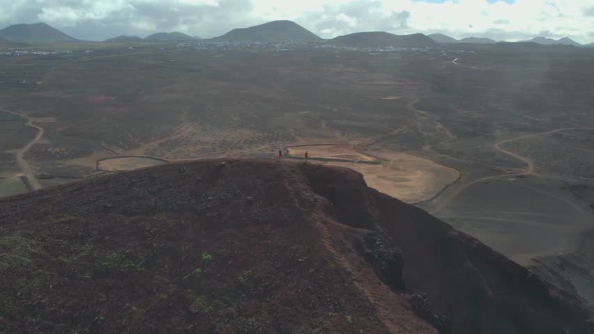 Aerial drone view of mountain sea and volcanoes in Lanzarote, Canary Islands, Spain