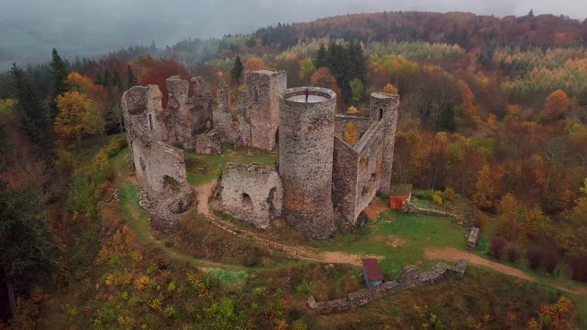 aerial shot around the Castle of the Cornes d'Urfé during fall on a foggy day in Champoly within the comte of Forez in the Loire departement, Rhone Alpes region, France