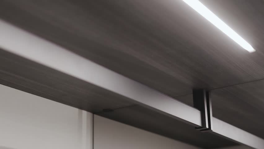 A close-up of a part of an empty workshop with led lighting, linear lighting for better aesthetics and functionality