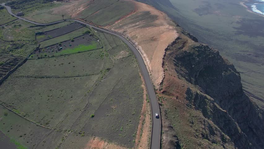 Aerial drone view of mountain sea and volcanoes in Lanzarote, Canary Islands, Spain