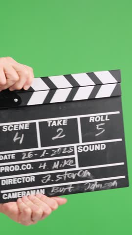 Film slate clapping on green screen for video production