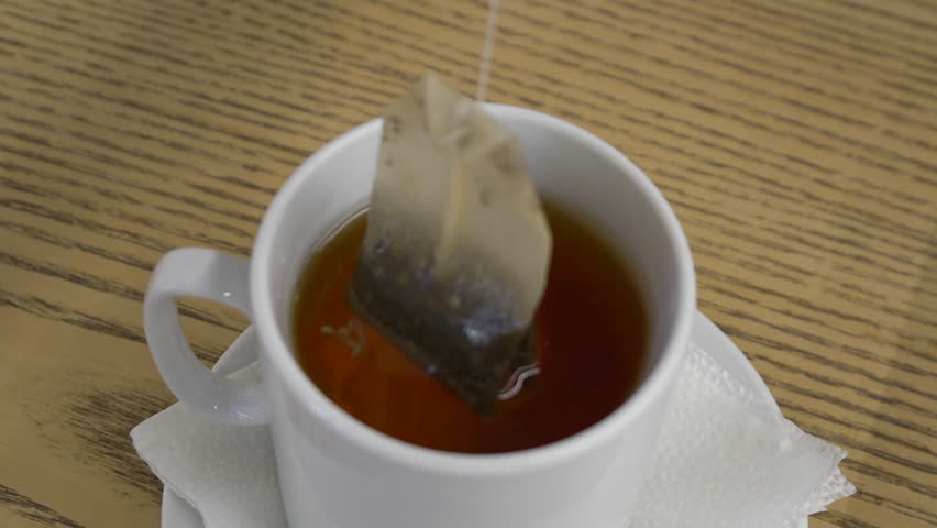 Steeping a Tea Bag in a White Mug