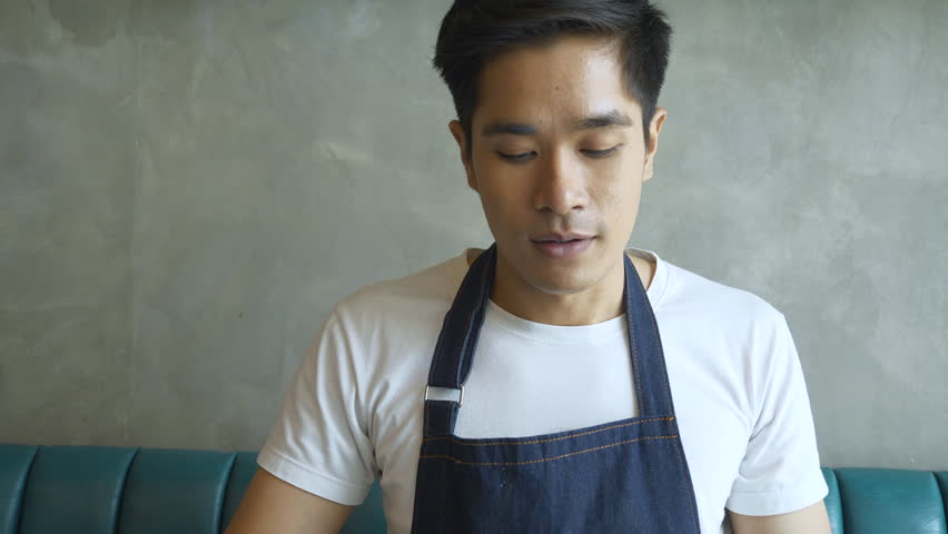 Barista happiness for smelling aromatic a cup of coffee in restaurant.