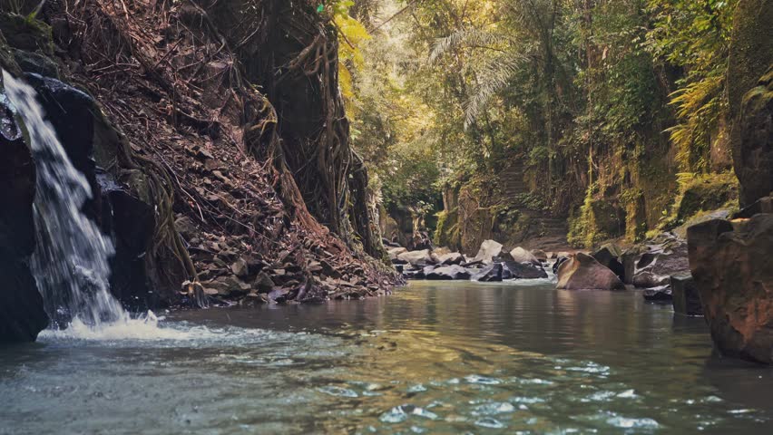 Bali Waterfall Kanto Lampo Waterfall one of the most beautiful tropical waterfalls Bali famous landmark and popular travel destination Bali, Indonesia 4K