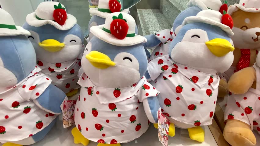 Soft toys for kids on shelves in children toy store,4K video 