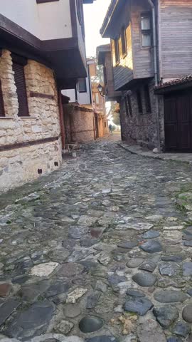 Nesebar, Bulgaria January 1, 2025: A person walking through ancient streets in winter