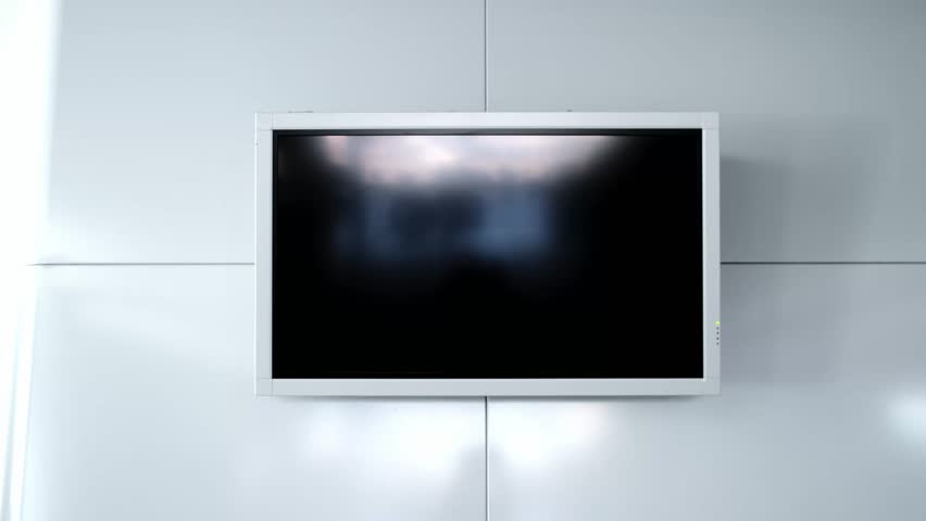Modern flat screen lcd TV or oled, black screen blank HD monitor. Turned off display board on grey wall background in public place. Non-working television. Widescreen scoreboard. Advertising panel. 4K
